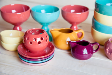 colorful tableware on a wooden background