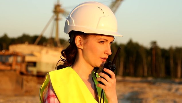 Woman having communication by walkie talkie