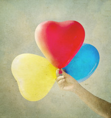 Multi colored balloons toned with a retro vintage