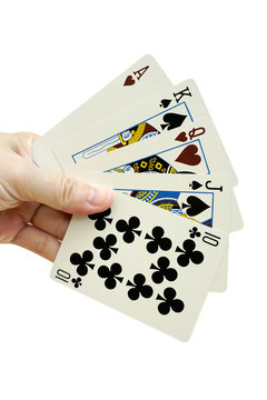 Hand with playing cards, isolated on white