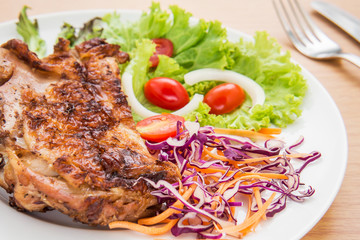 Grilled chicken with fresh vegetables on plate