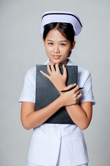 Young Asian nurse hold a clipboard