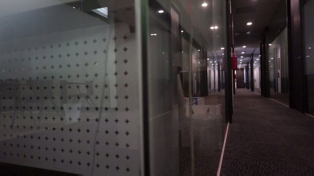 Dolly video of a dark empty office