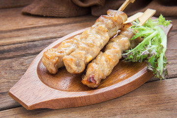 Grilled pork on wooden plate