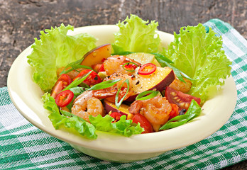 Shrimp salad with peaches, tomato, avocado and lettuce