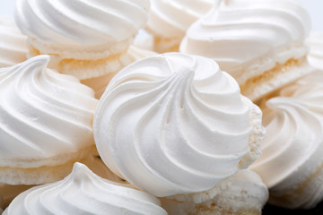 French vanilla meringue cookies on white background - obrazy, fototapety, plakaty