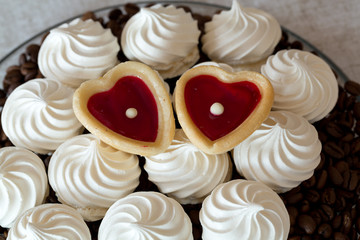 French vanilla meringue cookies and two sweet hearts