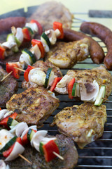 barbecue with delicious grilled meat and vegetables on grill