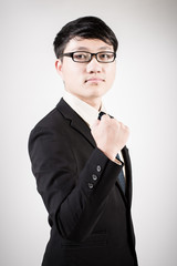 Successful young business man of Asian, full length portrait iso