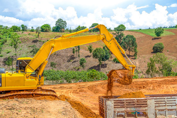 Backhoe loader loading dumper