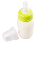Milk in a baby bottle over white background 