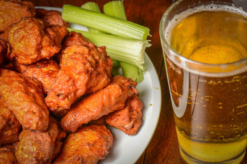 Buffalo Wings with Celery Sticks and Beer - 69796697