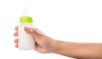 Female hand holding a baby bottle of milk  - 69797020