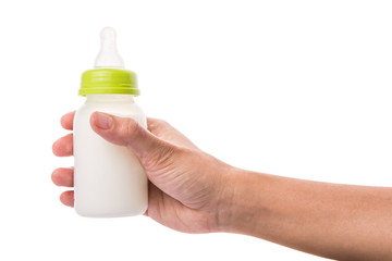 Female hand holding a baby bottle of milk  - 69797033