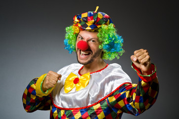 Funny clown in colourful costume