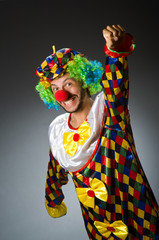 Funny clown in colourful costume