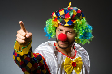 Funny clown in colourful costume