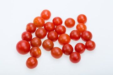 Fresh ripe cherry tomatoes isolated on a white background