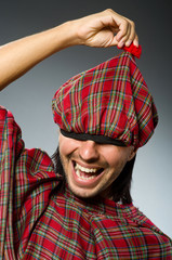 Funny scotsman in traditional clothing
