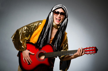 Fototapeta premium Guitar player with red instrument