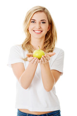 Woman with a green apple