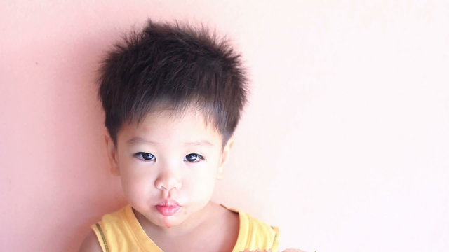 HD footage, close up Little Asian boy eating watermelon