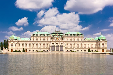 Fototapeta na wymiar Belvedere palace is reflected in fountain water, Vienna, Austria
