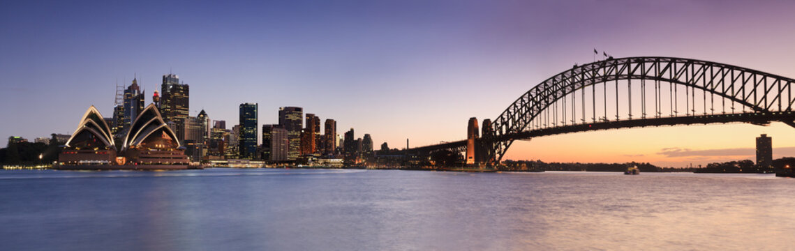 Fototapeta Fototapeta Sydney Harbour Bridge i Sydney Opera House podczas zachodu słońca panoramiczna