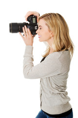 Woman photographer with DSLR
