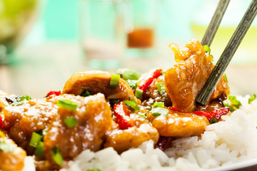 Sirloins on sweet and sour sauce served with rice