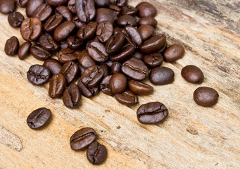 Coffee beans on wood background