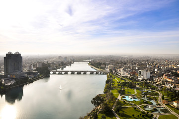 Fototapeta premium View of Adana and Seyhan river over the minaret of the mosque