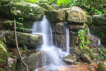 Fototapeta na wymiar waterfall and rocks covered with moss