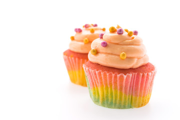 Colorful cupcakes isolated on white