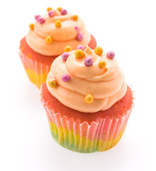 Colorful cupcakes isolated on white
