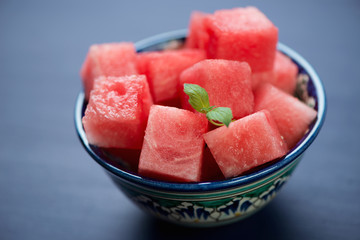 Close-up of a ceramic pialat with watermelon cubes, studio shot