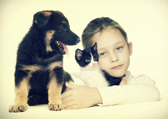 child and kitten and puppy