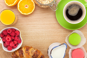 Healty breakfast with muesli, berries, orange juice, coffee and