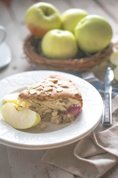 Apple pie on rustic wooden background