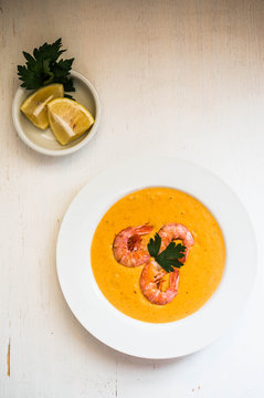 Shrimp soup with mussels on white background