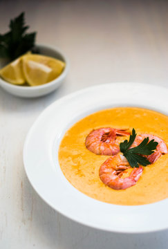 Shrimp soup with mussels on white background