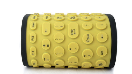 Flexible rubber computer keyboard isolated on white background