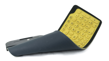 Flexible rubber computer keyboard isolated on white background