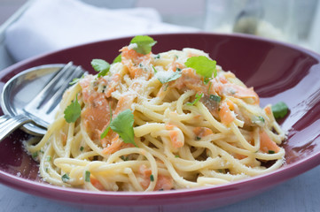 Spaghetti vegetarian with fork and spoon beside