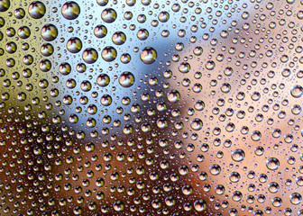 Colored Water Drops on a smooth glass surface