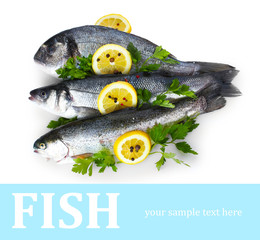 Fresh fishes with lemon, parsley and spice isolated on white