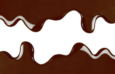 Melted chocolate dripping on white background
