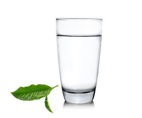 Glass of water and tea leaves ilsolated on white background