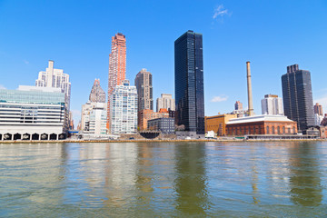 East River view of Manhattan waterfront skyscrapers in New York
