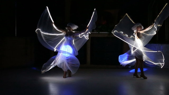 actress girl in white with LED wings